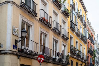 Madrid, Spain - October 17, 2020: Old residential building with iron balconies in the downtown of Madrid.