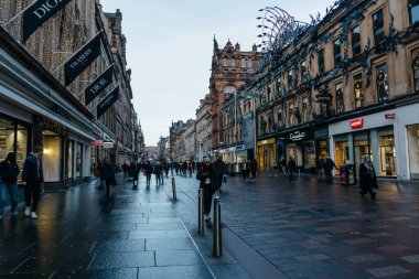 Glasgow, UK - December 6, 2023: Crowd of people in Buchanan Street during Christmas. It is a pedestrianised shopping area with luxury stores