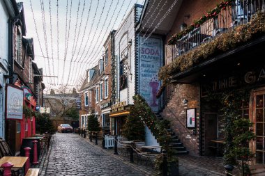 Glasgow, UK - December 6, 2023: View of Ashton Lane. It is a trendy area with pubs close to the University of Glasgow in the west end. clipart
