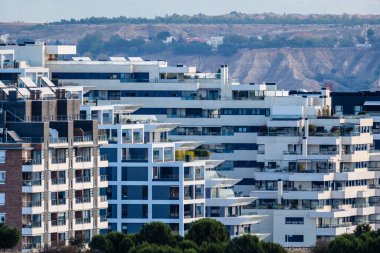 Cityscape of modern residential area with residential apartment buildings in Madrid. Real estate concept. clipart