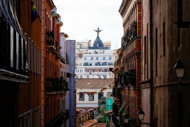 Street scene in Malasana or Malasana district in Madrid. Malasana is one of the trendiest neighborhoods in Madrid, well known for its counter-cultural scene clipart