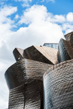 Bilbao, Spain - October 9, 2024: View of building of Guggenheim Museum by Frank Gehry architect on bank of Nervion river clipart