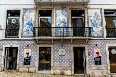 Lisbon, Portugal - October 29, 2022: A charming ice cream and bakery shop in the Alfama quarter of Lisbon, Portugal. Features traditional tiled facade.