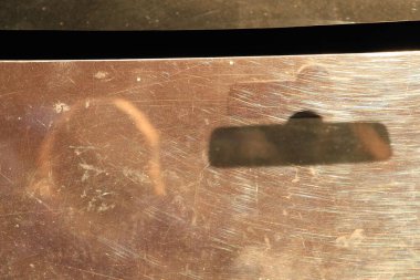 silhouettes of people through glass at sunset