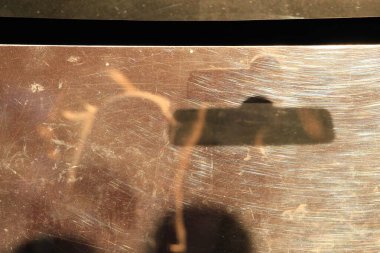 silhouettes of people through glass at sunset