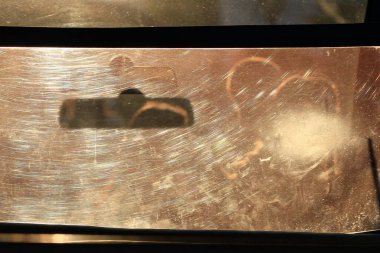 silhouettes of people through glass at sunset