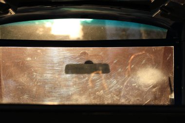 silhouettes of people through glass at sunset