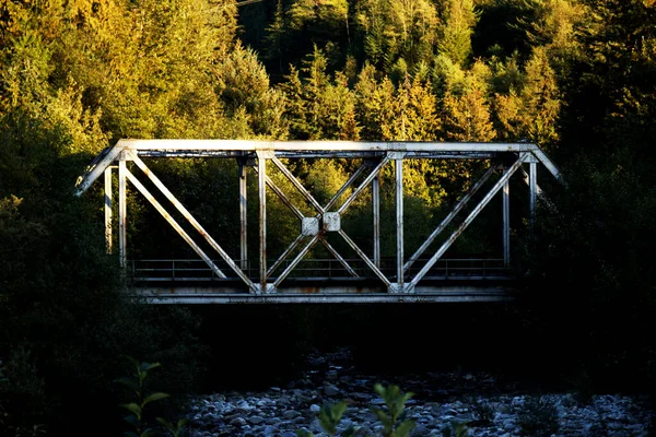 Old, metal railway bridge in the nature - sunshine