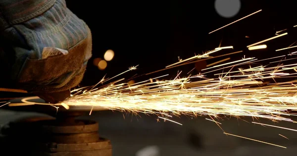 sparks from welding metal at a construction site.