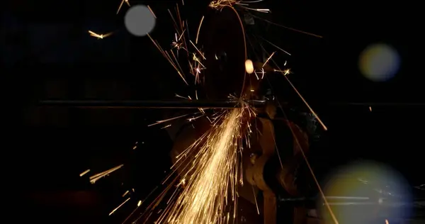 sparks from welding metal at a construction site. Cutting and processing of metal parts. High quality photo