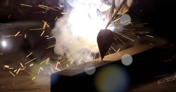sparks from welding metal at a construction site. Cutting and processing of metal parts. High quality photo