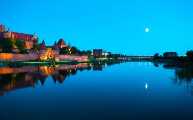 Marienburg castle the largest medieval brick castle in the world in the city of Malbork evening view at night