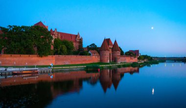 Marienburg castle the largest medieval brick castle in the world in the city of Malbork evening view at night