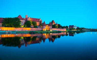Marienburg castle the largest medieval brick castle in the world in the city of Malbork evening view at night