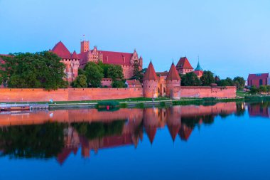 Marienburg castle the largest medieval brick castle in the world in the city of Malbork evening view at night