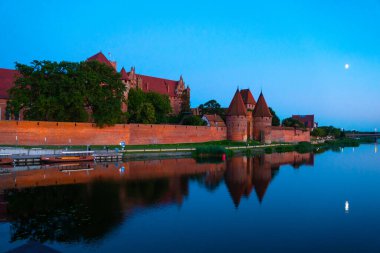 Marienburg castle the largest medieval brick castle in the world in the city of Malbork evening view at night