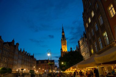 Scenic summer evening panorama of the architectural evening street of the Old Town GDANSK, POLAND - July 6, 2022