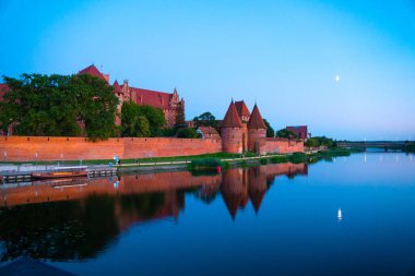 Marienburg castle the largest medieval brick castle in the world in the city of Malbork evening view at night