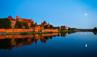 Marienburg castle the largest medieval brick castle in the world in the city of Malbork evening view at night