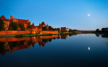 Marienburg castle the largest medieval brick castle in the world in the city of Malbork evening view at night