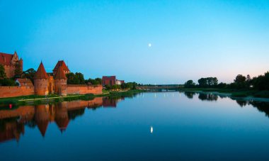 Marienburg castle the largest medieval brick castle in the world in the city of Malbork evening view at night