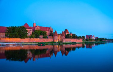Marienburg castle the largest medieval brick castle in the world in the city of Malbork evening view at night