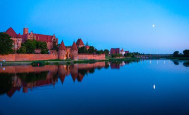 Marienburg castle the largest medieval brick castle in the world in the city of Malbork evening view at night