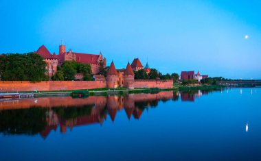 Marienburg castle the largest medieval brick castle in the world in the city of Malbork evening view at night