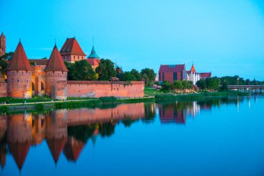 Marienburg castle the largest medieval brick castle in the world in the city of Malbork evening view at night