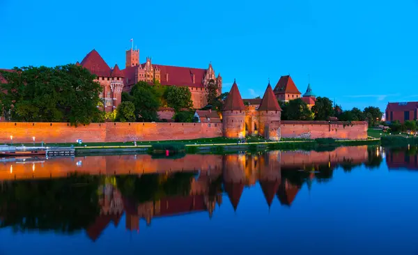 Marienburg castle the largest medieval brick castle in the world in the city of Malbork evening view at night