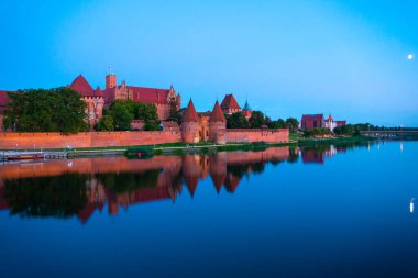 Marienburg castle the largest medieval brick castle in the world in the city of Malbork evening view at night