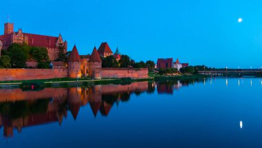Marienburg castle the largest medieval brick castle in the world in the city of Malbork evening view at night