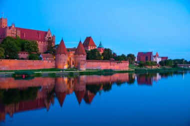 Marienburg castle the largest medieval brick castle in the world in the city of Malbork evening view at night