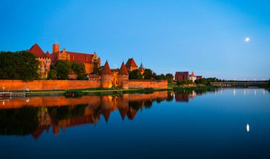 Marienburg castle the largest medieval brick castle in the world in the city of Malbork evening view at night