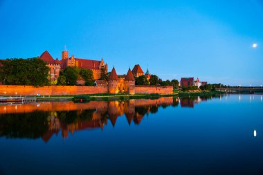 Marienburg castle the largest medieval brick castle in the world in the city of Malbork evening view at night