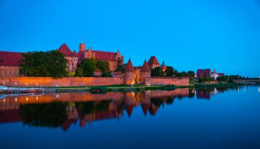Marienburg castle the largest medieval brick castle in the world in the city of Malbork evening view at night