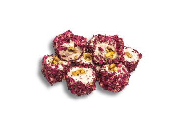 Beyaz arka planda serili, kremalı hindistan cevizli tatlı ruloların yakın çekimi. Tatlılar, tatlılar, hamur işleri ve gurmeler için mükemmel bir tema.