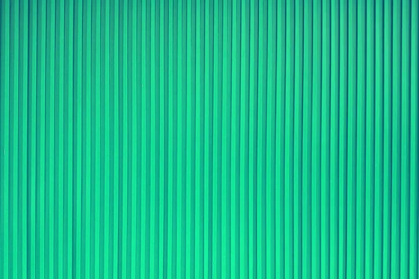 闭合绿色条纹墙纸为背景 — 图库照片