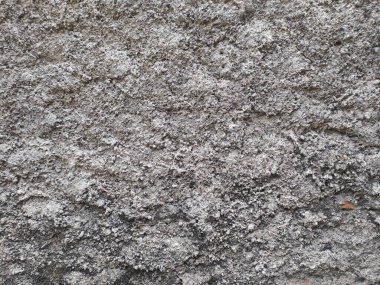 Gri desenli duvar arka planı, pürüzlü yüzey, yakın görüntü. Taş ya da beton zemin gerektiren tasarım projeleri için uygun.