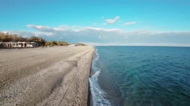 Calm winter ocean aerial view with fpv drone.