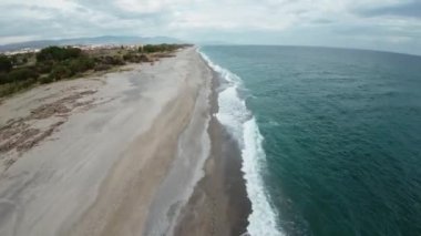 Calm winter ocean aerial view with fpv drone.