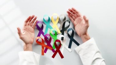 Bow symbol for world cancer day background overhead view