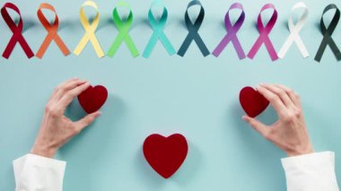 Bow symbol for world cancer day background overhead view