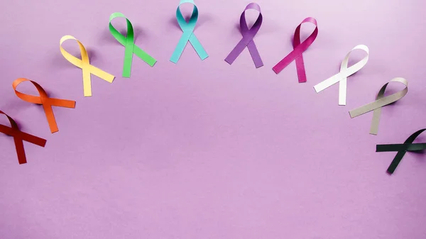 Bow symbol for world cancer day background overhead view