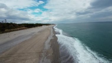 Calm winter ocean aerial view with fpv drone.