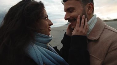 Romantic Couple Hug Together on the beach after sunset