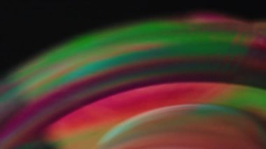 Abstract random paint oil color on the surface of a soap bubble macro view background
