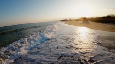Mediterranean rough sea aerial view in Italy state during the sunset sky in March.