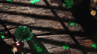 Celebrating the Saint Patrick day background on wooden table with green beer