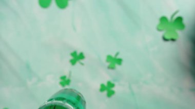 Celebrating the Saint Patrick day background on wooden table with green beer